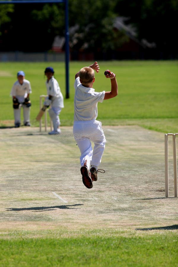 Young Man Bowling Cricket Ball Stock Photo Image of white, trees 2439028