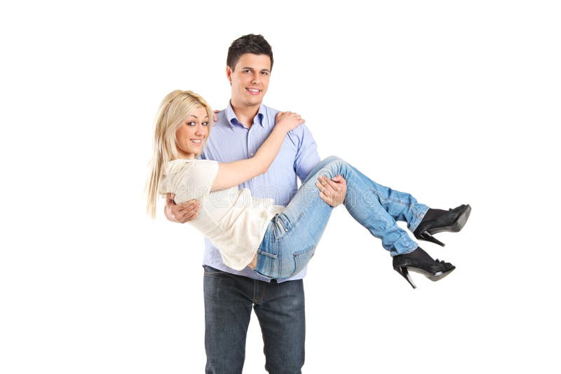 Young man carrying his girlfriend royalty free stock image Young man carrying his girlfriend royalty free stock image