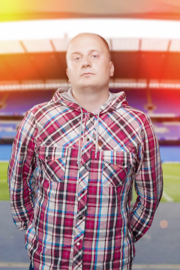 Young man in Casual against Stadium background