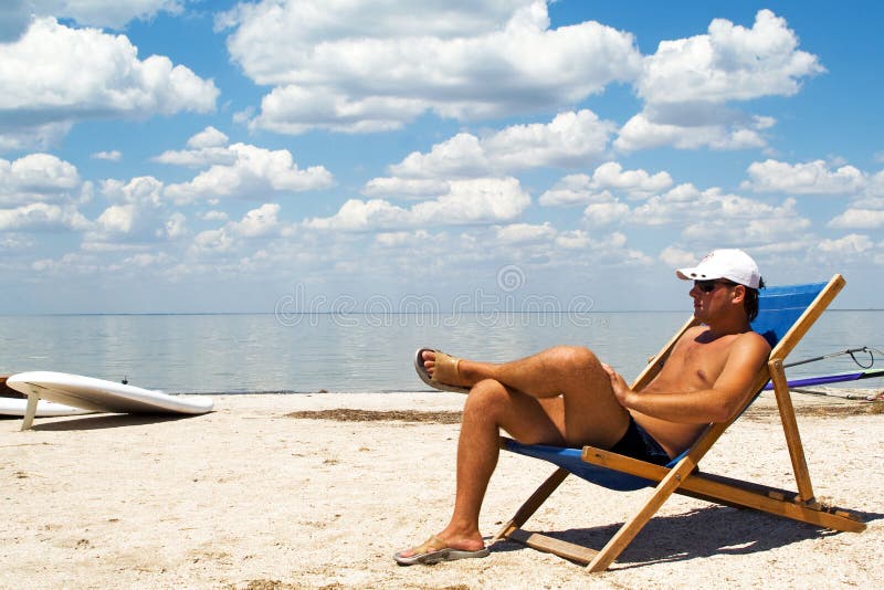 Young man on a chair on a beach