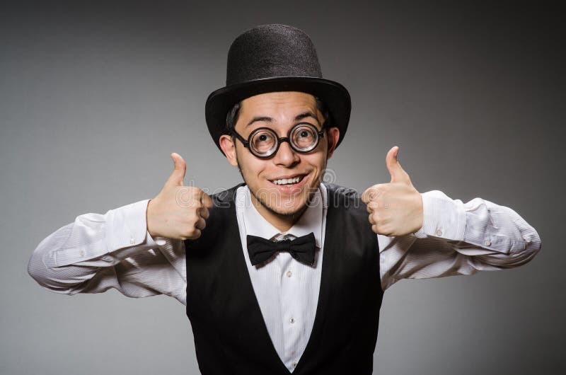 The young man in classical black vest and hat royalty free stock photography