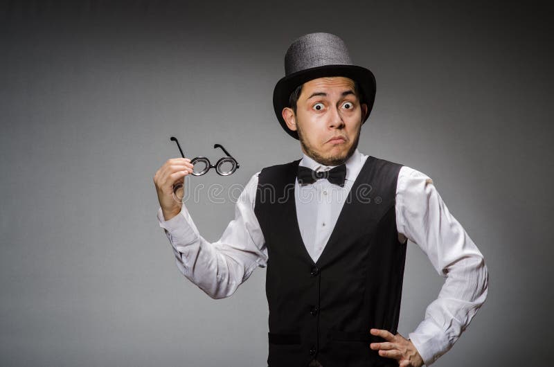 The young man in classical black vest and hat stock photography