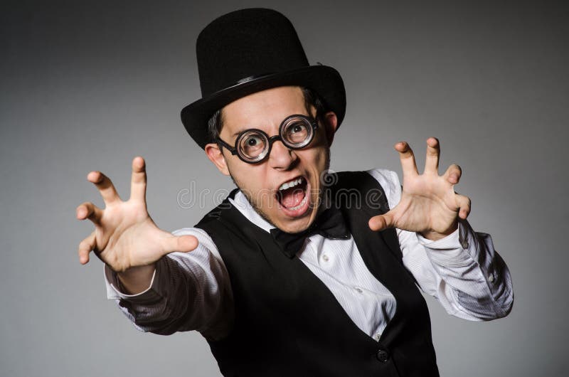 The young man in classical black vest and hat royalty free stock photo