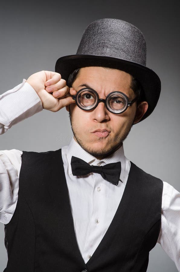 The young man in classical black vest and hat royalty free stock photo