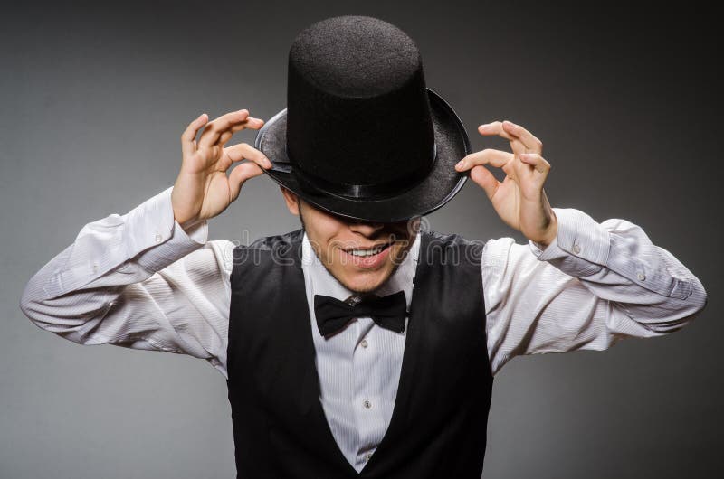 The young man in classical black vest and hat royalty free stock photos