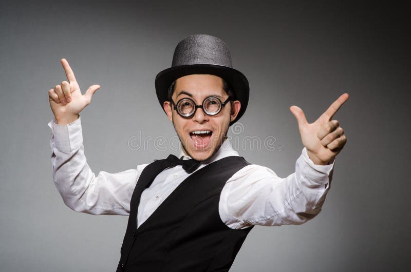The young man in classical black vest and hat stock photos
