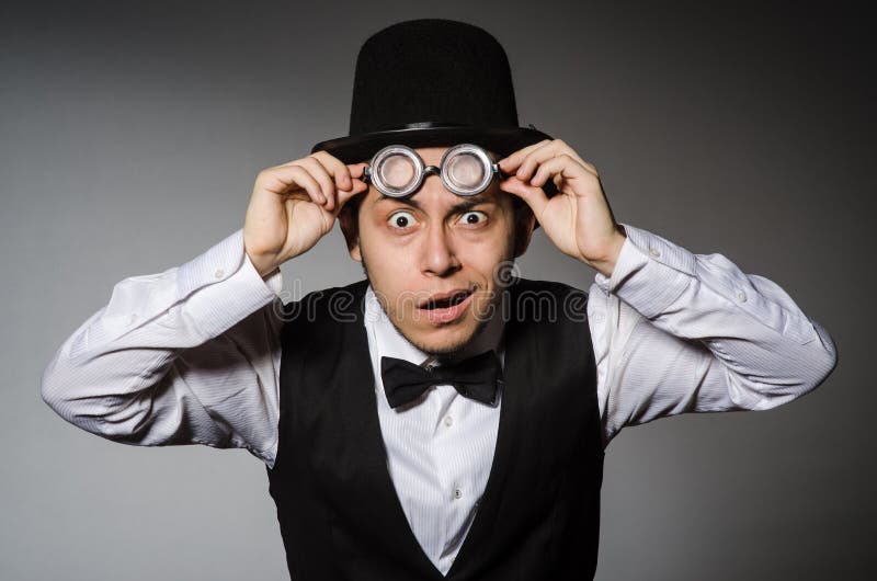 The young man in classical black vest and hat stock images