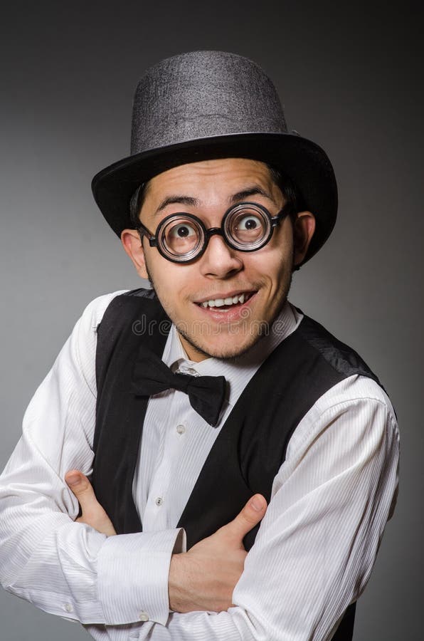 The young man in classical black vest and hat stock photography