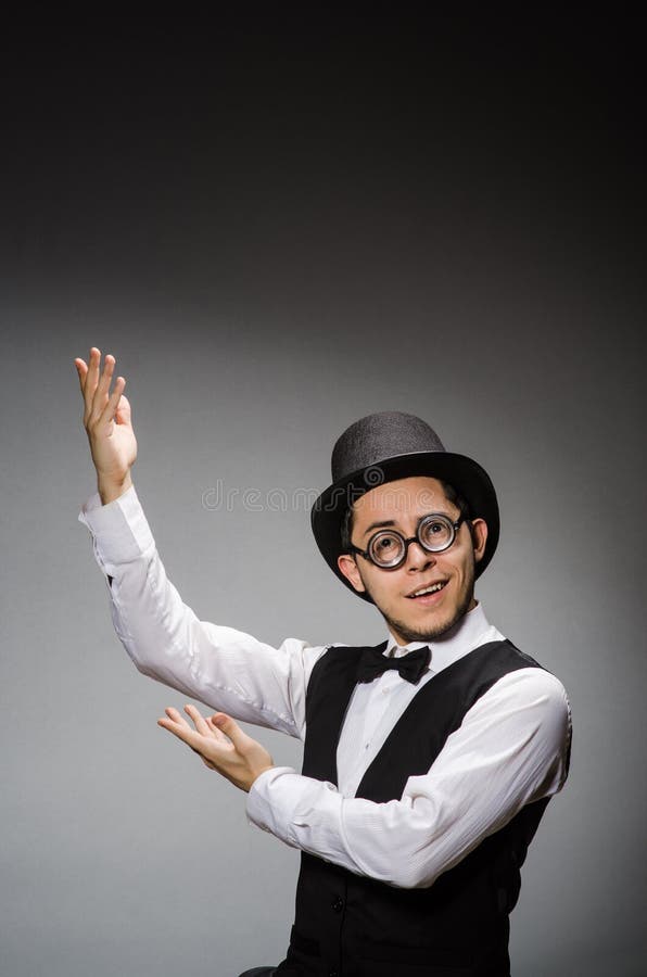 The young man in classical black vest and hat stock photo