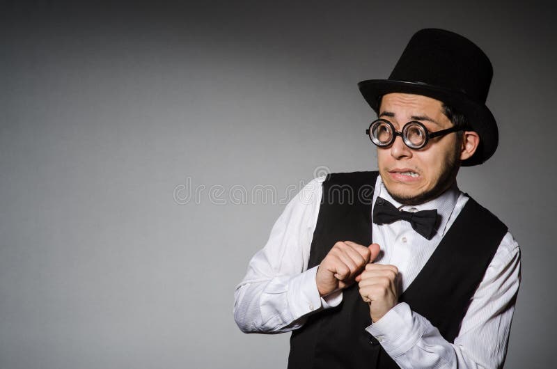 The young man in classical black vest and hat royalty free stock photo