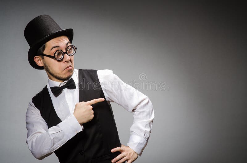 The young man in classical black vest and hat stock image
