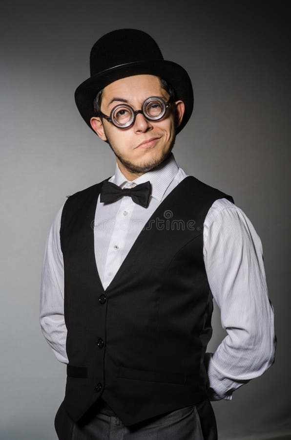 The young man in classical black vest and hat royalty free stock image