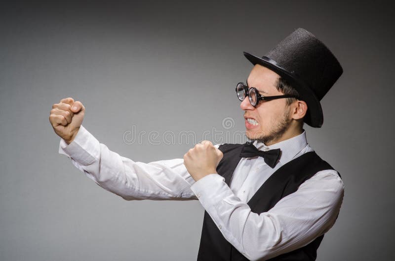 The young man in classical black vest and hat stock images
