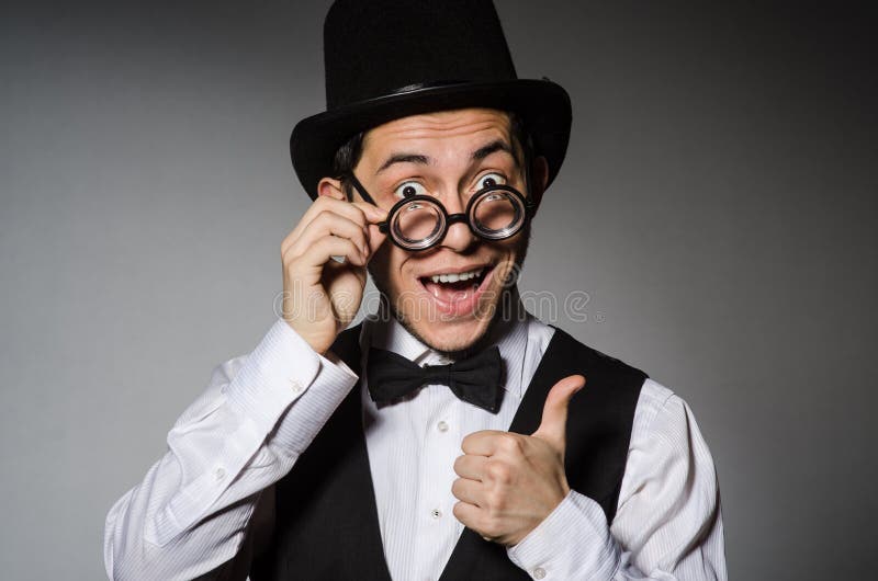 Young man in classical black vest and hat against royalty free stock photography
