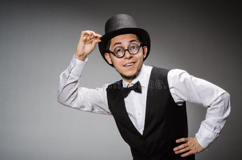 Young man in classical black vest and hat against royalty free stock photos