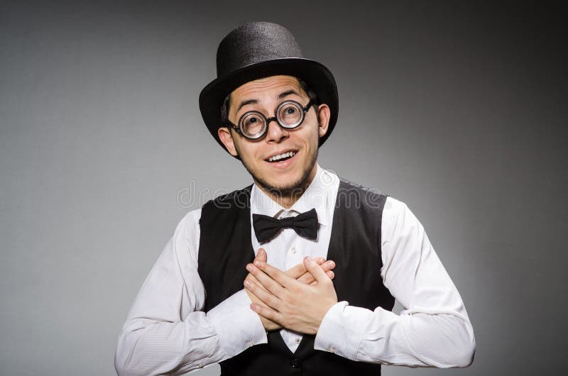 The young man in classical black vest and hat against gray royalty free stock photos