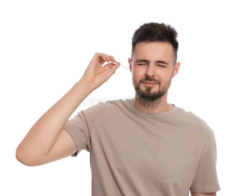 Young Man Cleaning Ear with Cotton Swab on White Background Stock Image