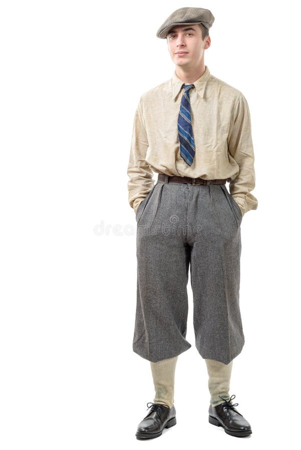 Young man with clothes and cap in 20s style. stock photo Young man with clothes and cap in 20s style. stock photo