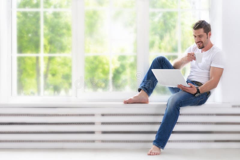 Young man with computer laptop