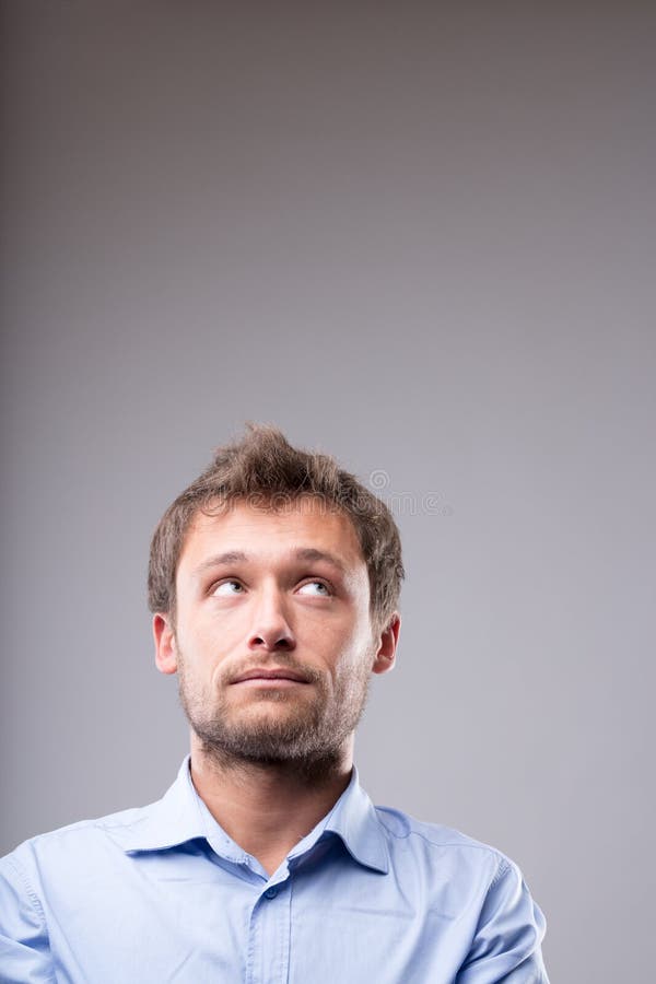 Young man with a contemplative expression stock image
