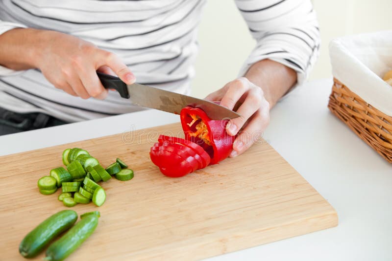 Young Man Cutting Vegetables in the Kitchen Stock Photo - Image of ...