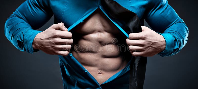 Young man displaying his abdominal muscles