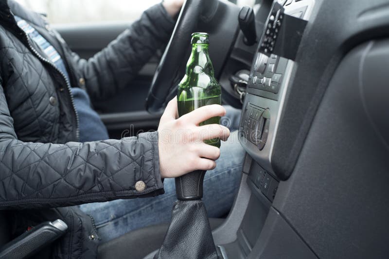 Young Man Driving His Car while Drinking Alcohol Stock Photo Image of