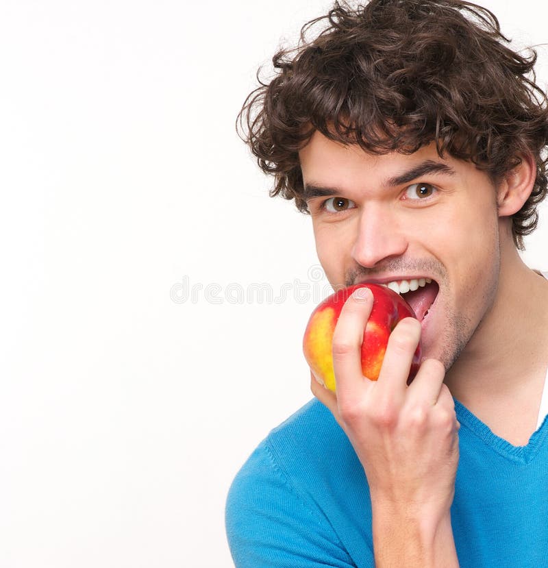 Young Man Eating Apple stock photo. Image of apple, face 29522212