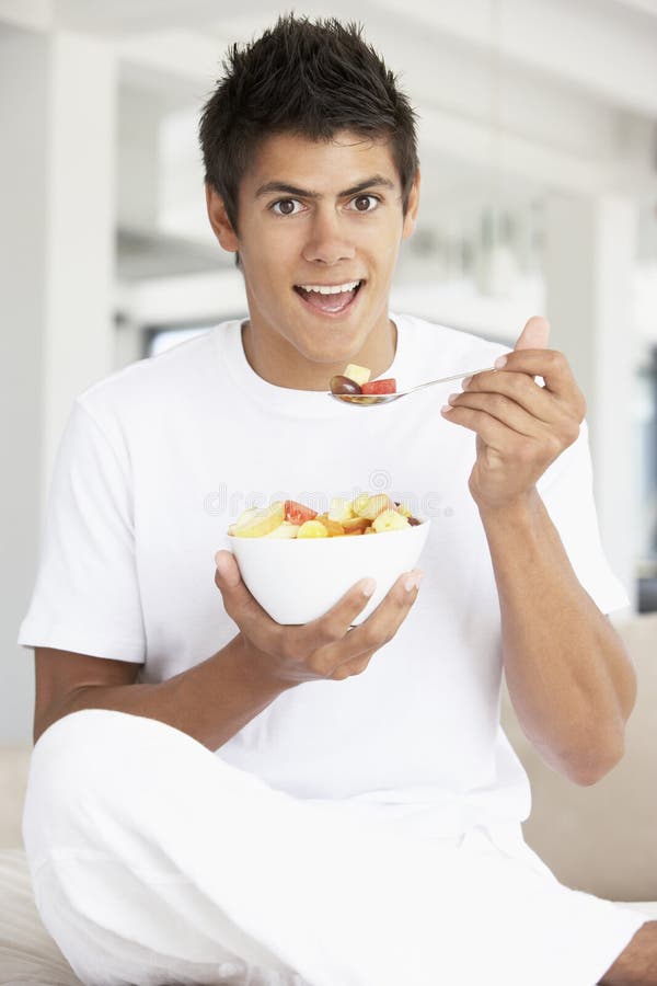 Young Man Eating Fresh Fruit Salad Stock Photo Image of enjoyment
