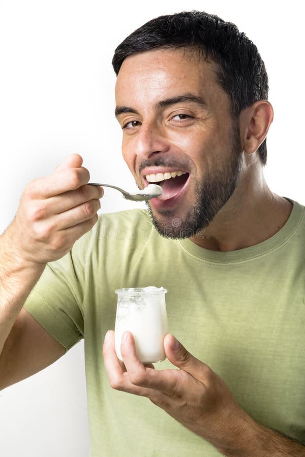 Young Man Eating Yogurt stock photo. Image of fresh, cheerful 33153462