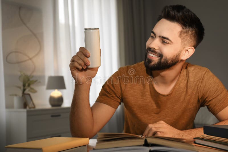 Young Man with Energy Drink Studying at Home Stock Image Image of education, exam 255996759