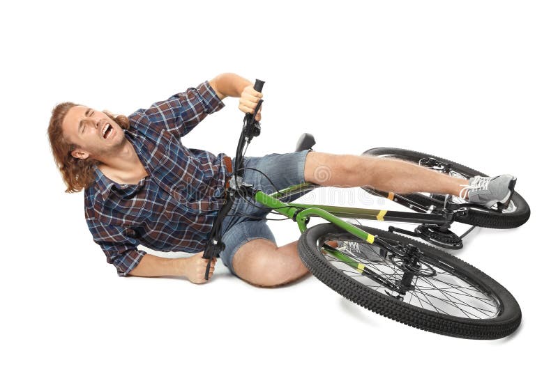 Young Man Falling Off His Bicycle On White Stock Image