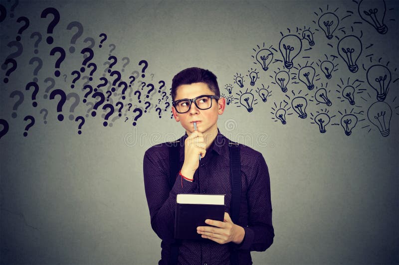 Young man finding answers to many questions generating ideas royalty free stock photography