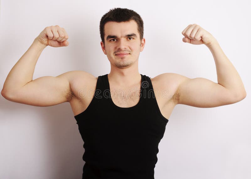 Young man flexing his muscles