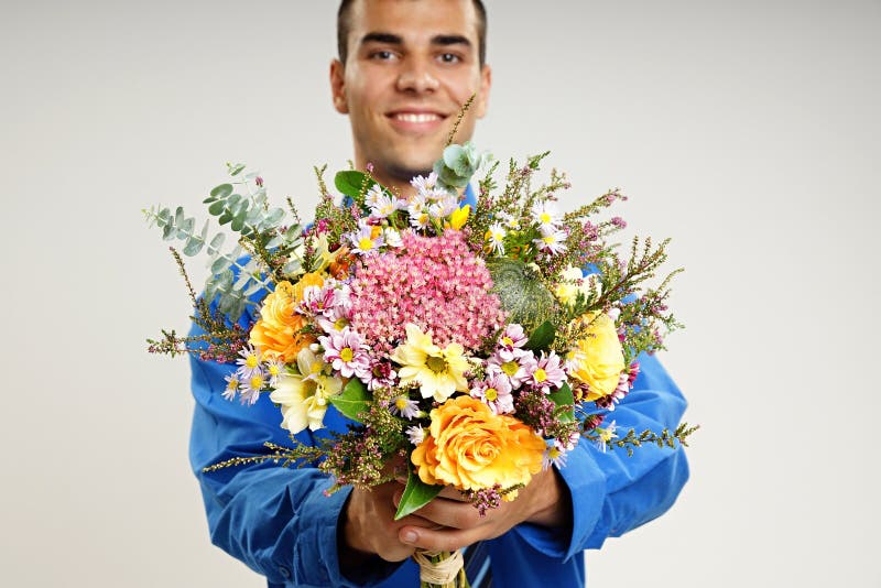 Young man with flowers