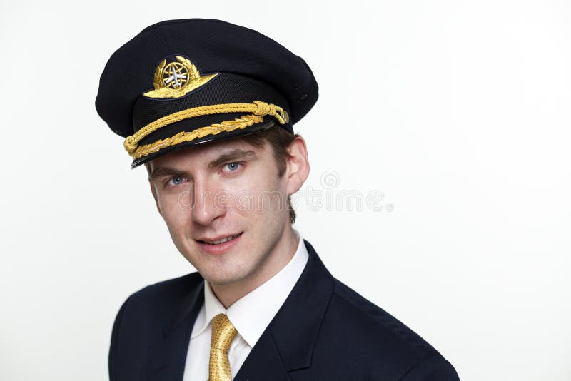 Young man in the form of a passenger plane pilot stock photography