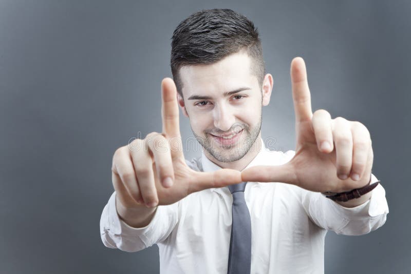 Young man framing face