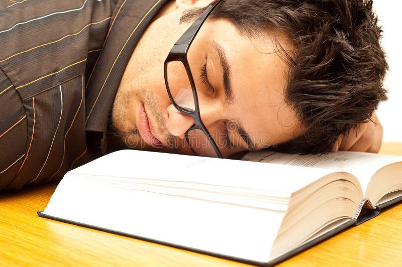 Young man with glasses fell asleep during reading. Young man with glasses fell asleep during reading