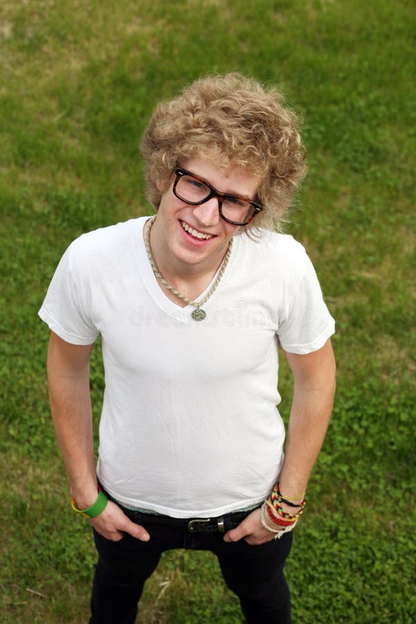 Blonde teen boy with oversize glasses and crazy hair. Blonde teen boy with oversize glasses and crazy hair