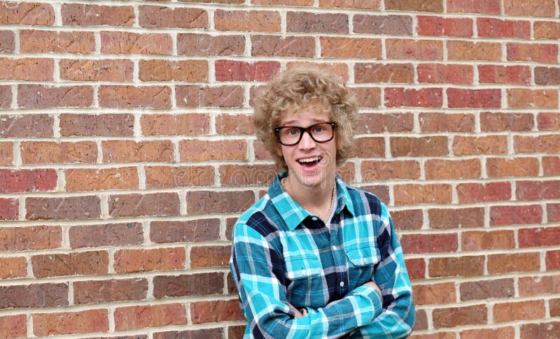 Blonde teen boy with oversize glasses and crazy hair. Blonde teen boy with oversize glasses and crazy hair