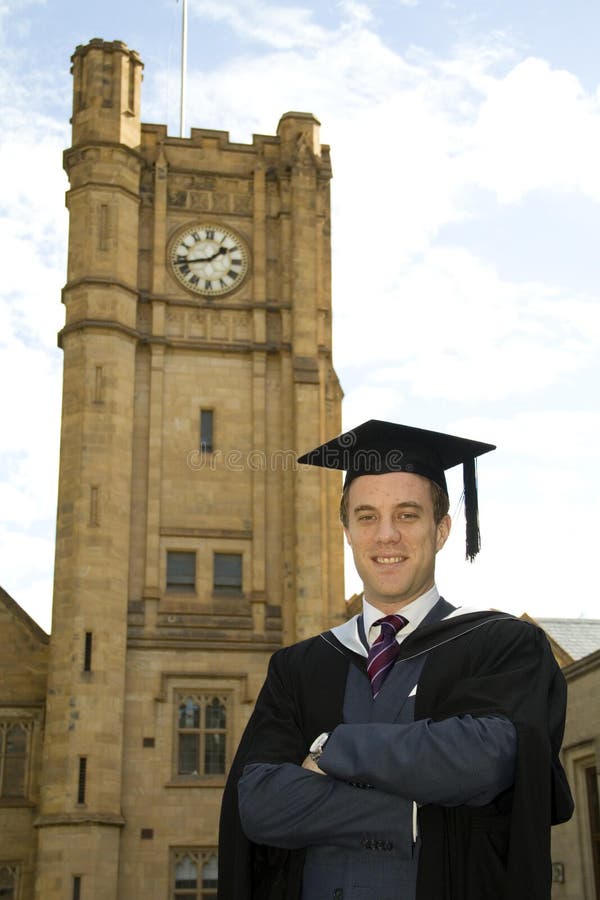 A young man in a graduation gown.