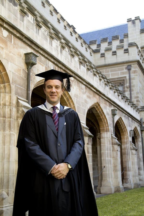 A young man in a graduation gown.