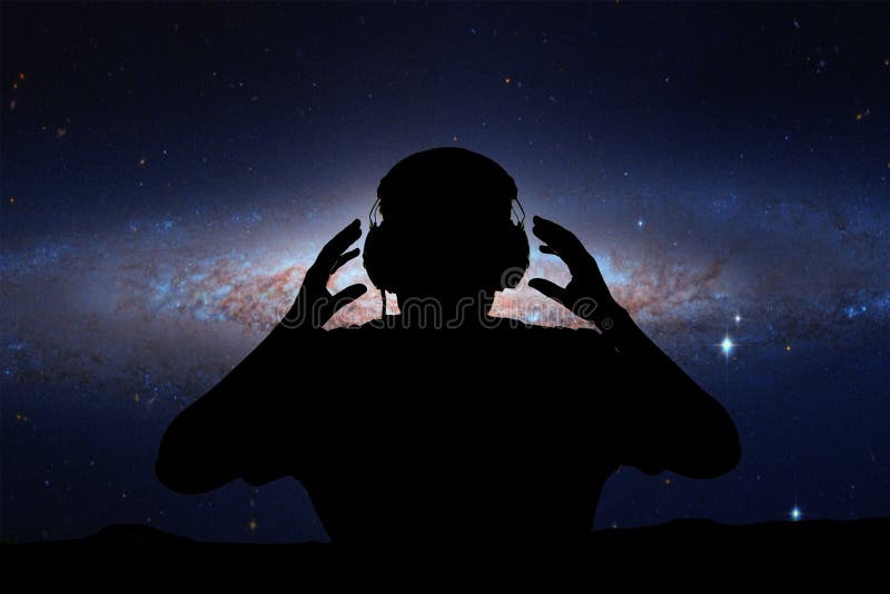 Listening To The Stars Young Man with Headphone on Stars Background. this Image Elements