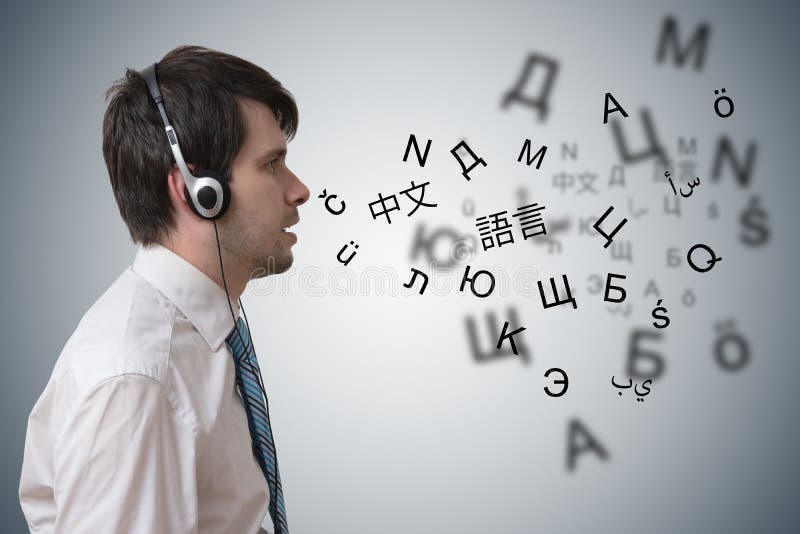 Young man with headphones is learning different foreign languages. stock photos Young man with headphones is learning different foreign languages. stock photos