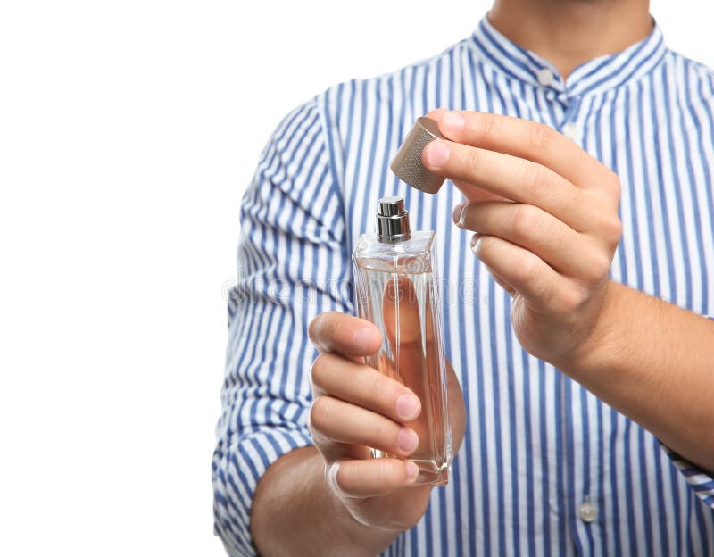 Young Man Holding Bottle of Perfume on White Background Stock Image ...