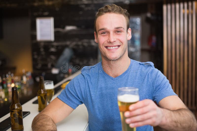 Young Man Holding Pint of Beer Stock Photo Image of weekend, smiling
