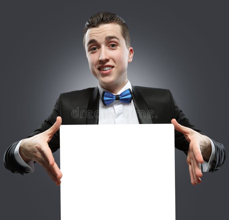 Young man holding a whiteboard.