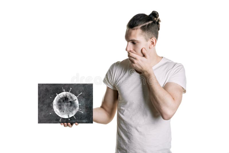 Young man holds a picture of bacteria. The danger of coronavirus. horizontal frame royalty free stock images