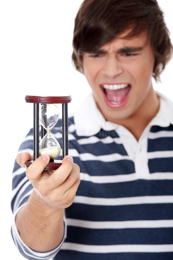Young Man With Hourglass. Stock Image - Image: 18753561
