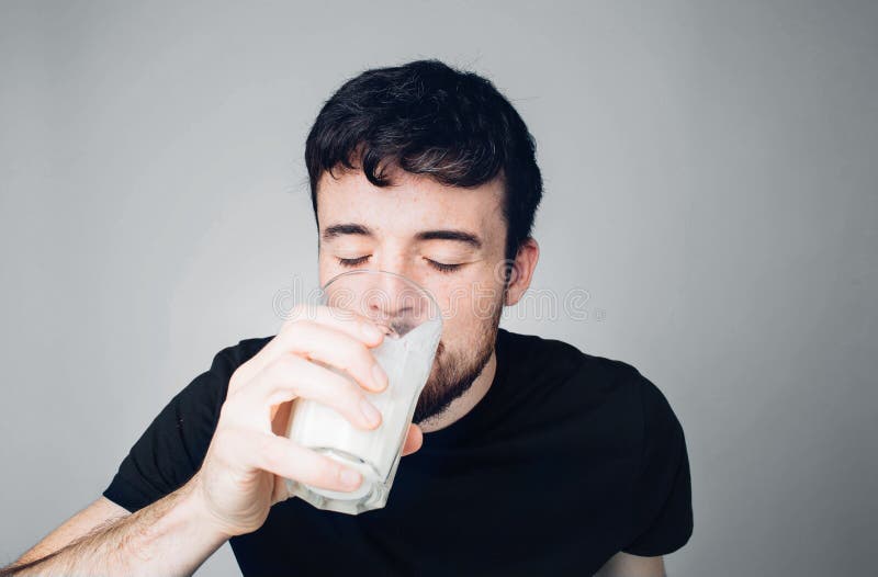 Young Man Isolated Over Background. Male Person in Casual Style Drink Milk or Sour Milk from Glass. Thirsty Stock Photo - Image of happiness, male: 177260024 Young Man Isolated Over Background. Male Person in Casual Style Drink Milk or Sour Milk from Glass. Thirsty Stock Photo - Image of happiness, male: 177260024